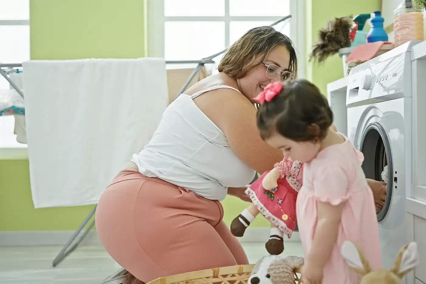 Mom and daugher in the family's laundry rroom